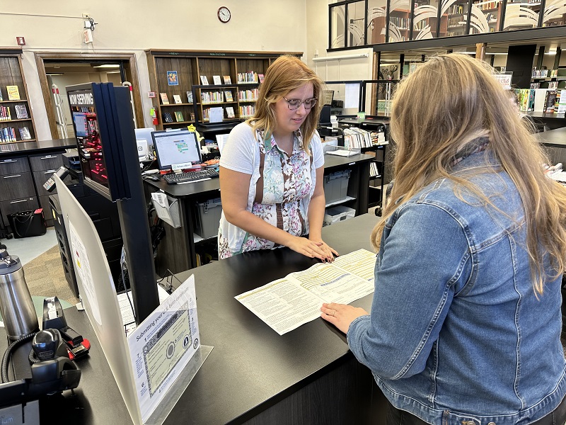 patron getting a passport at jvbrown