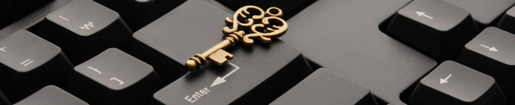 a key laying on a computer keyboard